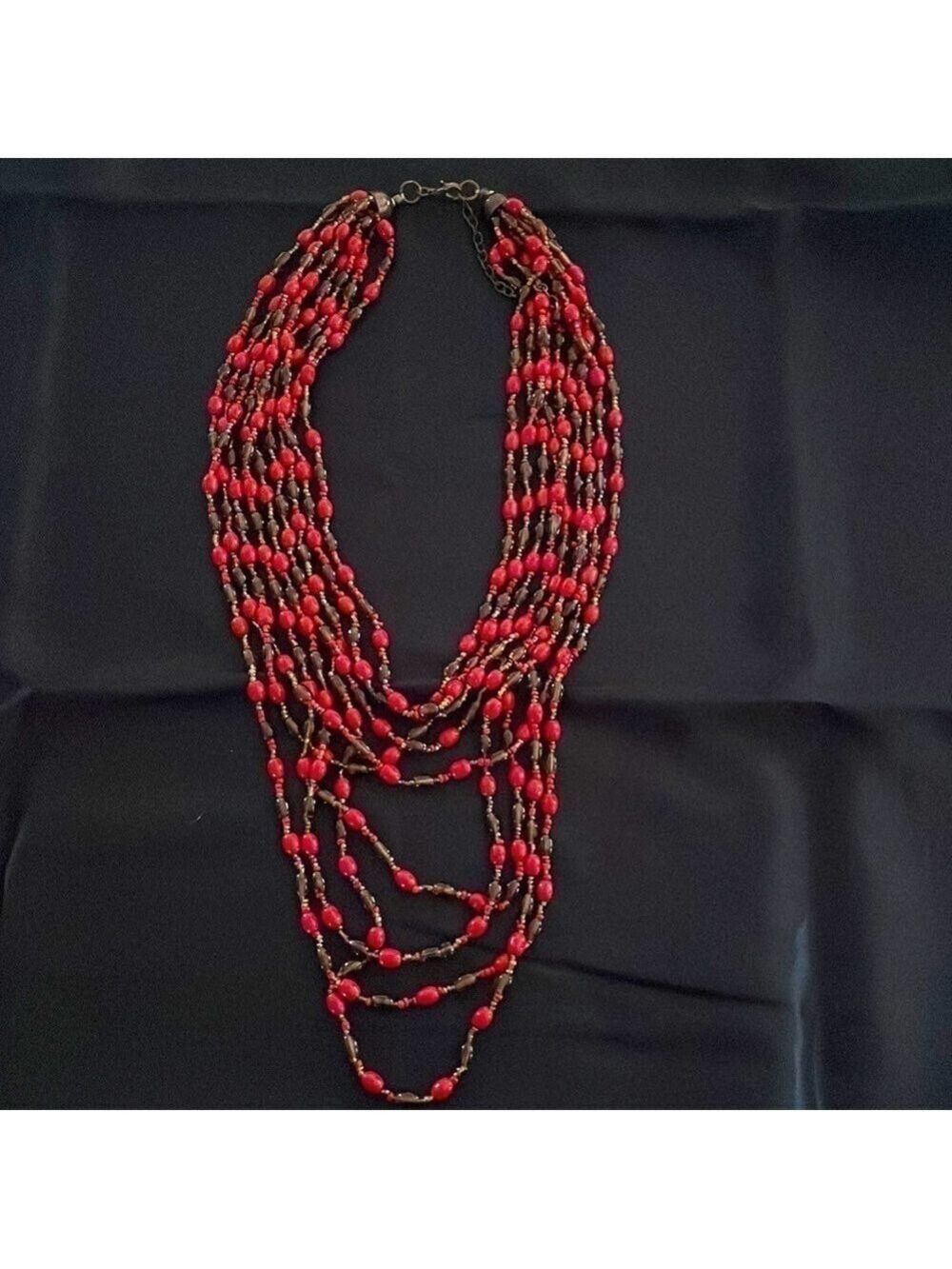 9 strand red and brown beaded necklace